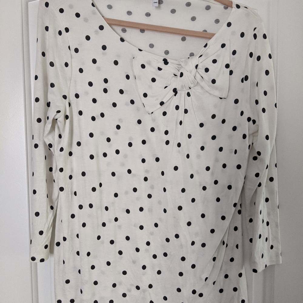 Elle white blouse with black polka dots.